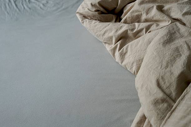 istock There is a bed that has a cozy blanket and a soft pillow resting on it bedsheet messy unmade do bed routine housekeeping 2238083586