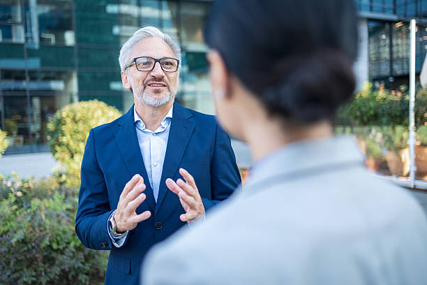 istock Businessman talking outdoors to business partner 2238087634