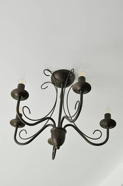 istock Elegant chandelier fixture against a white ceiling 2238087861