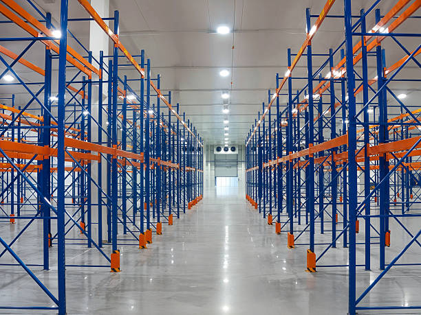 istock Empty warehouse with metal shelving creating a spacious interior and organized storage. 2238088019