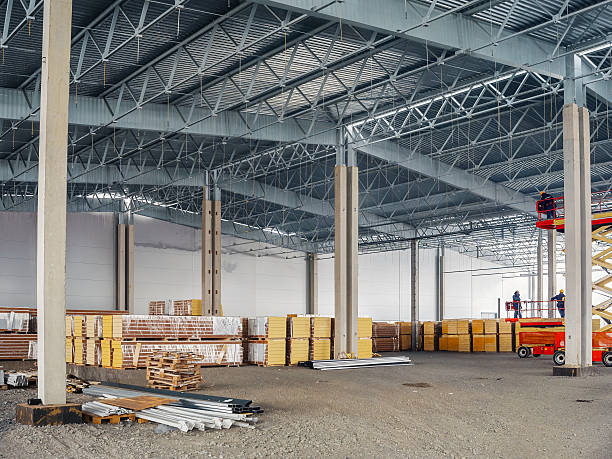 istock Inside a large warehouse during its construction phase, showcasing the steel framework and storage materials. 2238088023