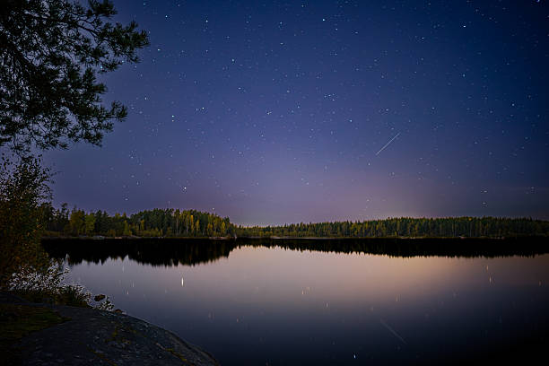 istock Autumn Night Sky Reflected on Finnish Lake 2238089579