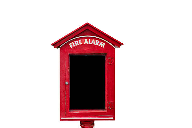 A metal fire safety plan box next to the fire alarm monitor faces the streets outside the building.