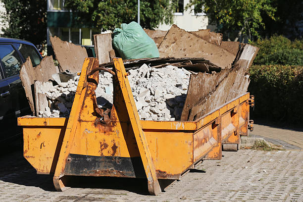 istock Container with construction debris. Yellow skip full of renovation waste. 2238090469