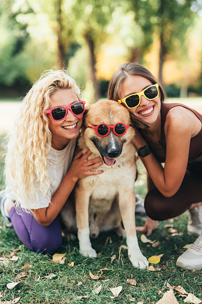 istock Best friends having fun with their cool dog 2238091656