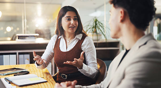 istock Meeting, creative and people explain in office for planning, intern training and article feedback. Woman, talking and team listening for steps, coaching advice and headline ideas of story publication 2238092340