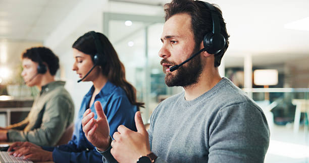istock Man, call center and discussion with headset at office, contact us or explain for customer service solution. Person, agent and consultant with talk, advice and info for problem solving at workplace 2238092533