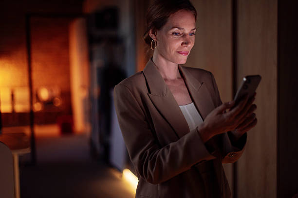istock Businesswoman Using Smartphone at Work in a Modern Office Setting 2238093311