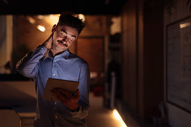 istock Business Professional Working Late in Warm Office Environment With Digital Tablet 2238093324