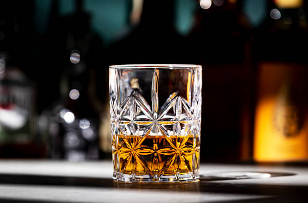 istock Scotch whiskey glass on dark green background with strong alcoholic drinks set. Spirits, liqueurs, distillates etc. in glasses and bottles. 2238097212