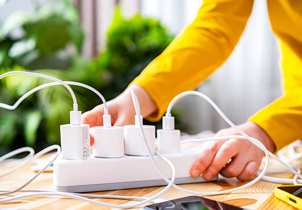 istock Organizing multiple chargers on a power strip while working in a bright home office environment 2238097256