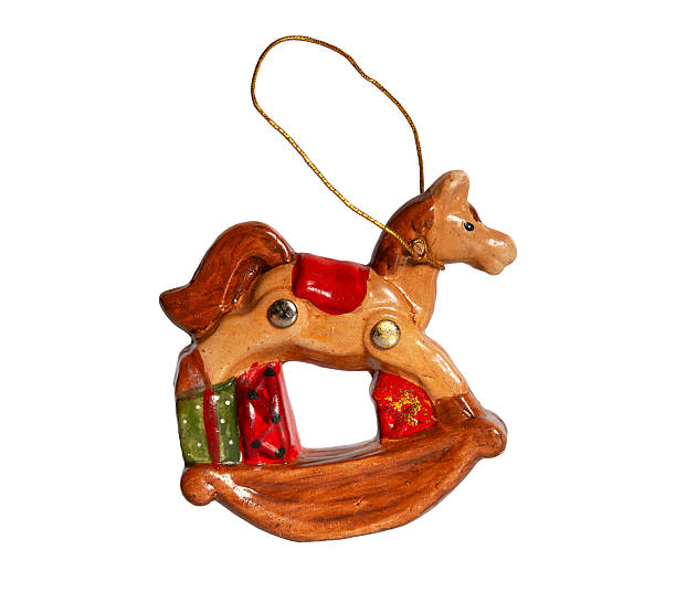 istock Rocking horse Christmas tree decoration. Ceramic Christmas tree decoration on a string, isolated on a white background. 2238100918