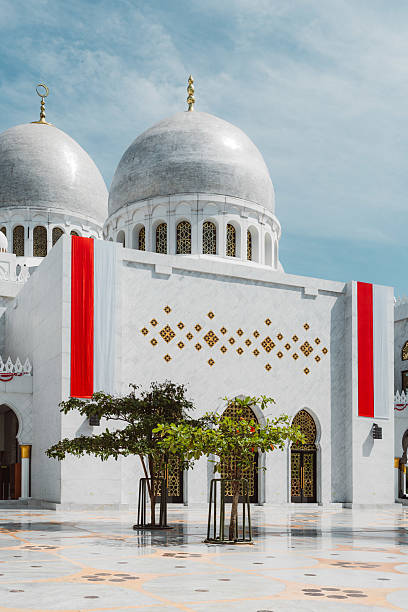 istock Stunning white mosque with domes and red accents 2238104354