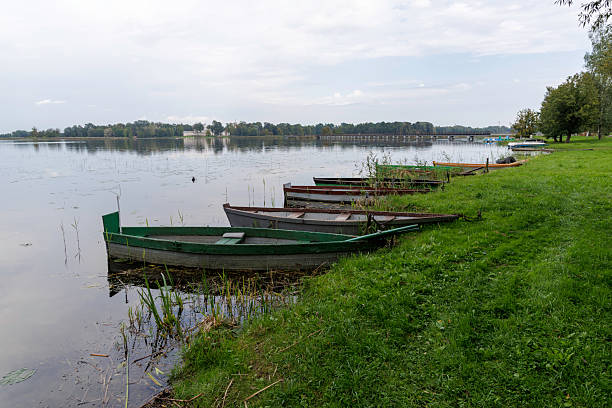 istock Rowboats Lined up on Calm Lakeshore 2238105273