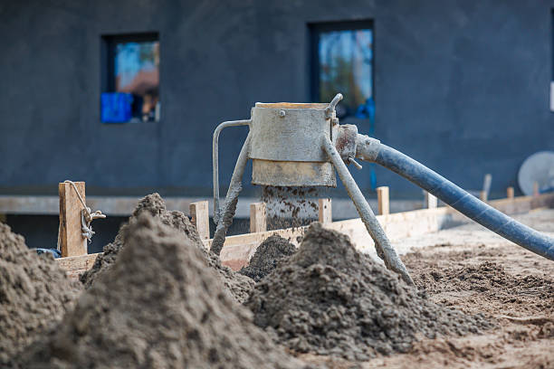 istock Construction Site with Concrete Pouring Machine and Building Wall 2238106369