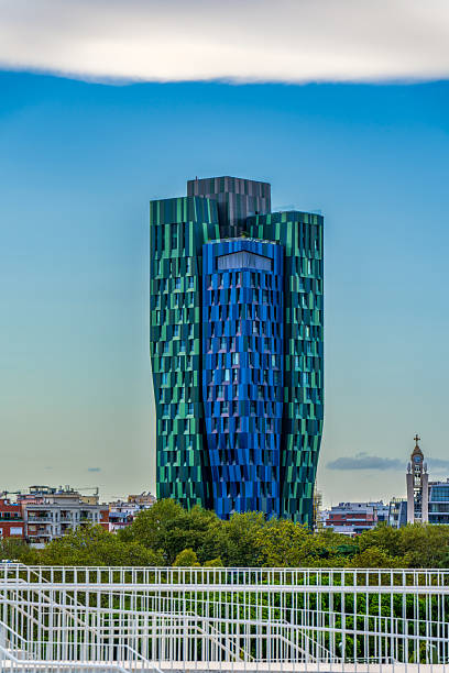 istock Striking Modern Green and Blue Glass Skyscraper with Unique Curved Facade Against a Clear Sky in the Heart of Tirana, Albania 2238106439