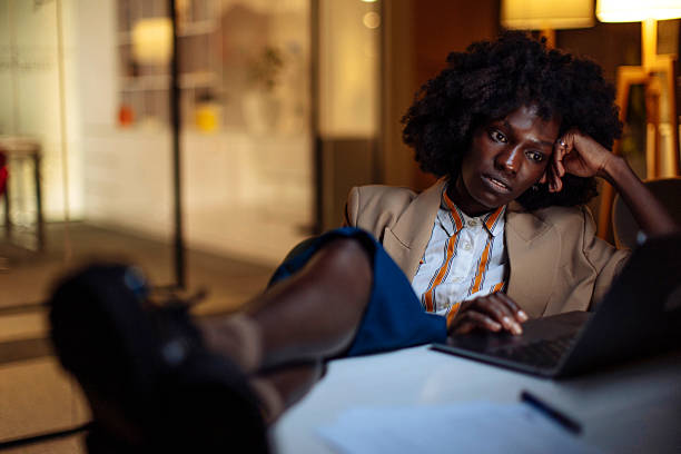 istock Thoughtful Professional Woman Working Late in a Modern Office Setting 2238107936
