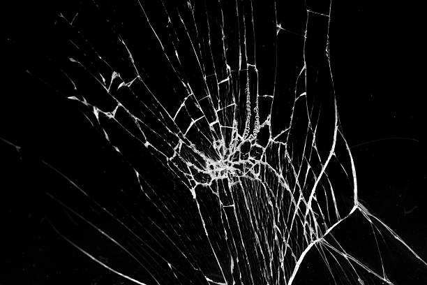 istock cracked glass isolated in black background 2238108142