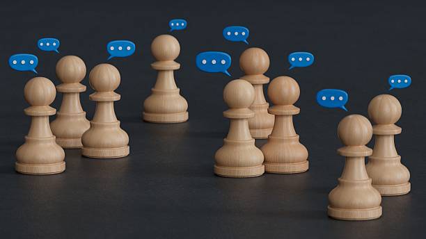 istock Team discussion, Community or social feedback. Communication or announcement dialog. Business meeting. Teamwork and communication concept. Many wooden figure with speech bubble. 2238109263