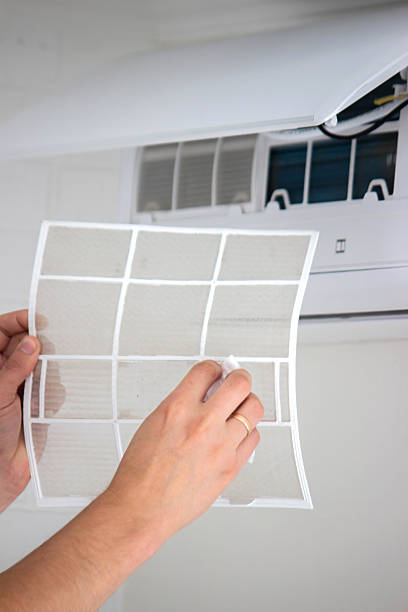 istock Air Conditioner Maintenance: Removing a Dirty Air Filter 2238111253