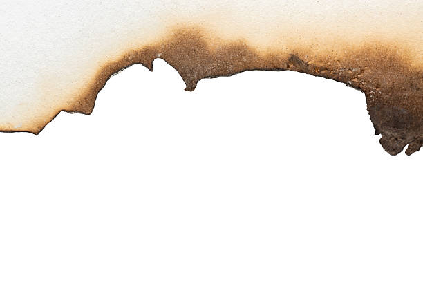 istock Fire burned white paper edges background texture isolated on white background 2238111487