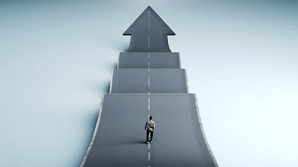 istock Man walking on a bending up and down road with arrow at the end symbolizing growth, resilience and success, 3D Render 2238112840