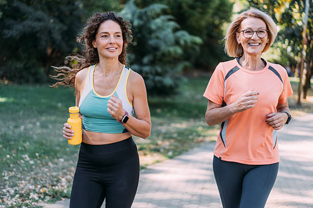 istock Friends talking and running in the public park. 2238113018