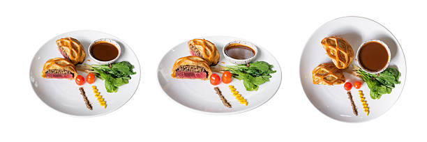 Gourmet Dish: A close-up, top-down perspective captures an artfully plated gourmet dish, featuring succulent pastry, flavorful sauce, and fresh garnishes.