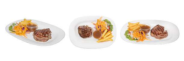 Culinary Trio: A visually striking presentation of a delectable meal, featuring a tender steak, crispy fries, and a flavorful sauce, artfully arranged on an elegant plate.