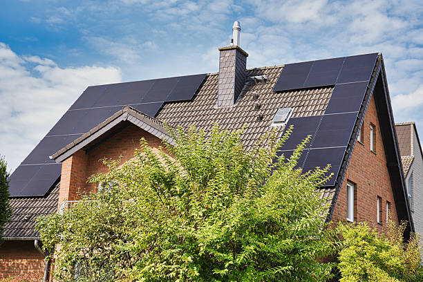 istock Modern house with solar panels installed on roof for renewable energy 2238113252