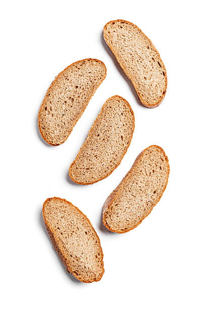 istock Slices of wheat bread isolated on white background 2238114465