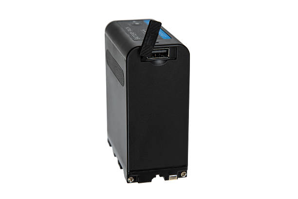 istock Side view of a black professional camera battery pack featuring a USB power output port. 2238115224