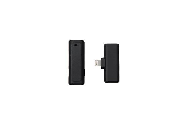 istock Wireless lavalier microphone transmitter with clip and receiver, isolated on white. 2238115254