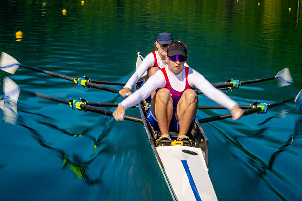 istock Blurred Motion Rowers Racing on Serene Lake 2238115854