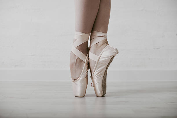 istock Poised grace young ballerinas pointe shoes in subtle lighting 2238117018