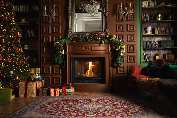 istock Classical Christmas decorated interior living room with fireplace. Christmas tree with red golden ornament decorations gift boxes. Modern classic style interior design apartment, Christmas eve at home 2238117367