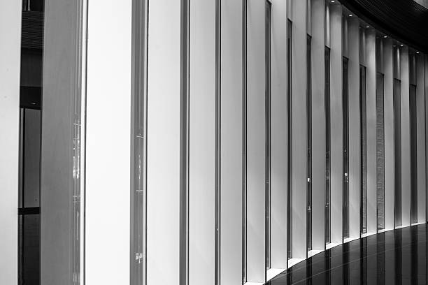 istock A minimalist black and white image of a curved wall with vertical slats creates a modern architectural accent 2238118016