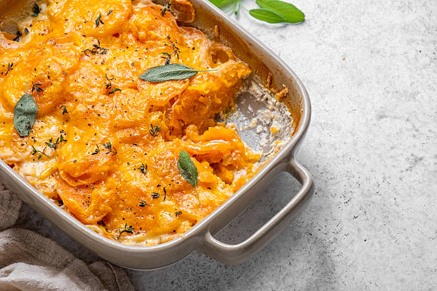 istock A casserole dish with a yellowish orange color and a white lid 2238119290