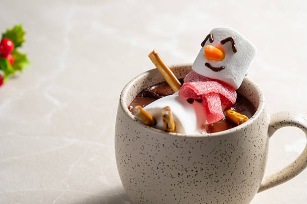 istock A white mug with marshmallows and a snowman on top 2238119397
