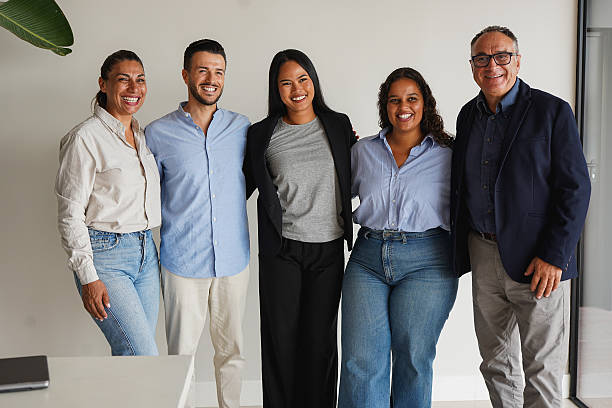 istock Multiracial business people smiling in front of camera inside modern office - Multi generational colleagues, success and teamwork concept 2238120956