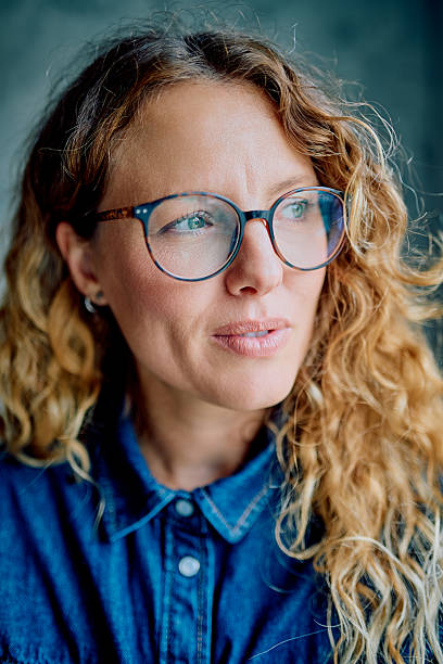 istock Woman wearing glasses looking contemplating future 2238128501