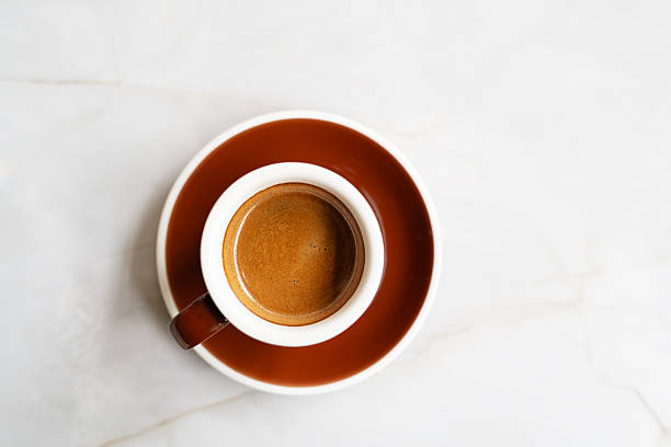 istock expresso coffee in a brown coffee cup on white marble surface 2238128594