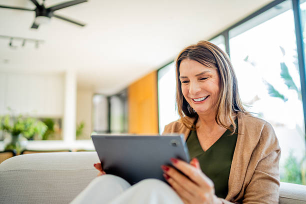 istock European senior woman using digital tablet at home 2238129243