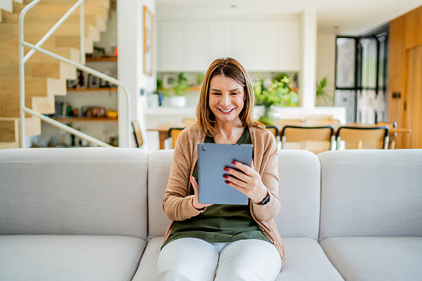 istock European senior woman using digital tablet at home 2238129244