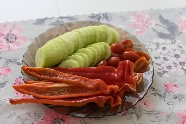 Bell pepper, cherry tomato and cucumber on a plate. Vegetable plate