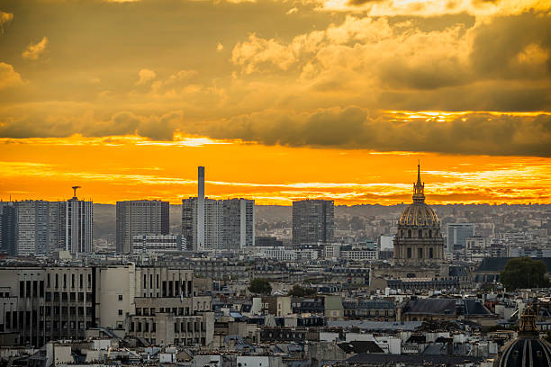 Paris, France - 09 27 2025: Panoramic view of Les Invalides Dome and buildings at sunset