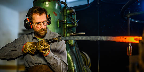 istock Caucasian Blacksmith Skillfully Heating Metal in Traditional Forge 2238131724