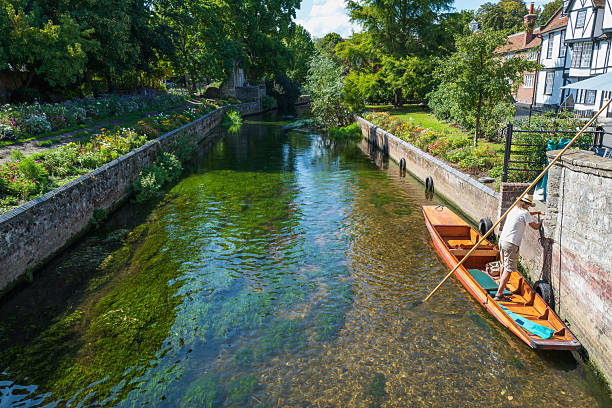 Canterbury, UK - Sep 2025 A view along the river Stour in Canterbury Kent. A Punt is mored along side the river wall. The day is warm and sunny.