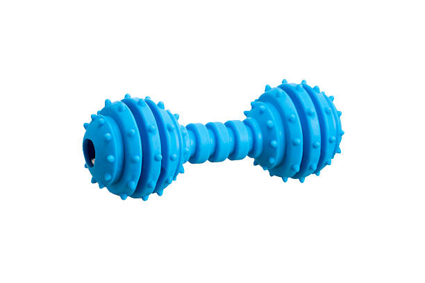 istock A pink, dumbbell-shaped dog toy with small pimples. isolated on white 2238136269