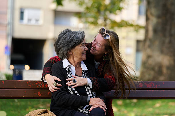 istock Embracing Generations: A Daughter's Love and Support for Her Senior Mother on a Sunny Day in the Park 2238136277